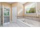 Inviting bathroom features a soaking tub and a window for plenty of natural light at 150 Northchase Dr, Concord, NC 28027