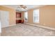 Bright bedroom features neutral carpet, trim, and walls and built-in desk and cabinets at 150 Northchase Dr, Concord, NC 28027