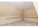 Spacious bonus room with custom shelving, neutral color scheme, and soft carpet at 150 Northchase Dr, Concord, NC 28027