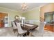 Elegant dining room boasting a large wood table, sophisticated chandelier, and neutral decor at 150 Northchase Dr, Concord, NC 28027