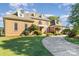 Two-story brick home with well-maintained lawn and landscaping, showcasing a welcoming entrance at 150 Northchase Dr, Concord, NC 28027