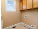 Functional laundry room with cabinet storage and utility connections at 150 Northchase Dr, Concord, NC 28027