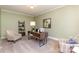 Inviting home office features neutral walls, plush carpeting, and a stylish modern desk at 150 Northchase Dr, Concord, NC 28027