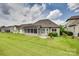 Spacious backyard featuring a cozy screened porch and well-maintained lawn and landscape at 15927 Vale Ridge Dr, Charlotte, NC 28278