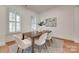 Inviting dining room featuring white walls, plantation shutters, and a stylish table with seating for six at 15927 Vale Ridge Dr, Charlotte, NC 28278