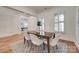 Bright dining room featuring plantation shutters, a wood table with seating for six, and hardwood floors at 15927 Vale Ridge Dr, Charlotte, NC 28278