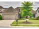 Charming brick home with a well-manicured lawn and a mature tree, complemented by a two-car garage at 15927 Vale Ridge Dr, Charlotte, NC 28278
