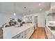 Open kitchen design with a large island, modern appliances, and seamless flow to the living area at 15927 Vale Ridge Dr, Charlotte, NC 28278