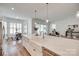 Bright kitchen with stainless steel appliances, quartz countertops, and adjacent dining area at 15927 Vale Ridge Dr, Charlotte, NC 28278
