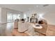 Spacious living room with neutral tones, hardwood flooring, and view to covered patio at 15927 Vale Ridge Dr, Charlotte, NC 28278