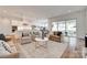 Open-concept living area featuring a modern kitchen, dining space, and a comfortable seating arrangement at 15927 Vale Ridge Dr, Charlotte, NC 28278