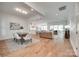 Bright open-concept living space features wood floors and seamlessly connects the dining, kitchen, and living areas at 15927 Vale Ridge Dr, Charlotte, NC 28278