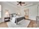 Spacious bedroom boasts a ceiling fan, hardwood floors and ensuite bath access at 15927 Vale Ridge Dr, Charlotte, NC 28278