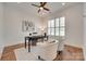 Cozy office space with natural light from plantation shutters, a ceiling fan, and modern decor at 15927 Vale Ridge Dr, Charlotte, NC 28278