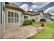 Charming home featuring a brick patio area perfect for entertaining and relaxing outdoors at 15927 Vale Ridge Dr, Charlotte, NC 28278