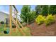 This beautiful backyard features a swingset and plenty of green grass at 1620 Callahan Rd, Fort Mill, SC 29715