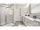 Bright bathroom featuring a glass-enclosed shower and a vanity with ample counter space at 1620 Callahan Rd, Fort Mill, SC 29715
