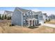 A two-story blue house displaying a landscaped yard, an attached two-car garage, and a welcoming front porch at 1620 Callahan Rd, Fort Mill, SC 29715