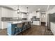 Modern kitchen island with pendant lighting, granite countertops, and bar stool seating at 1620 Callahan Rd, Fort Mill, SC 29715