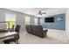 Spacious living room with abundant natural light, complemented by a modern ceiling fan at 1620 Callahan Rd, Fort Mill, SC 29715