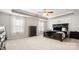 Serene main bedroom showcasing tray ceilings, soft carpet, and modern furniture at 1620 Callahan Rd, Fort Mill, SC 29715
