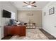 Well-lit office with a large desk, neutral-toned walls, and a modern ceiling fan at 1620 Callahan Rd, Fort Mill, SC 29715
