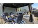 Covered patio with a dining set, outdoor rugs and a seating area near the backyard at 1620 Callahan Rd, Fort Mill, SC 29715