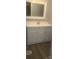 Bathroom featuring a white vanity with a modern faucet and a large mirror at 181 Trivette Rd, Harmony, NC 28634