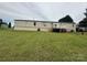 Exterior shot of the home featuring a deck overlooking a expansive lawn at 181 Trivette Rd, Harmony, NC 28634