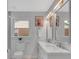 Bright bathroom featuring double sinks, decorative mirrors, and modern fixtures at 1829 Jennings St, Charlotte, NC 28216