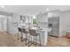 Modern kitchen features a large center island with seating and stylish pendant lighting at 1829 Jennings St, Charlotte, NC 28216