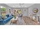 Sun-filled living room features wood floors, neutral walls, a large window view and stylish furnishings at 1829 Jennings St, Charlotte, NC 28216