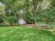 Backyard shed with green space and mature landscaping at 1915 Winthrop Ave, Charlotte, NC 28203