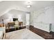 Bedroom featuring hardwood floor, light walls, a desk with chair, and coastal map mural at 1915 Winthrop Ave, Charlotte, NC 28203