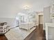 Cozy bedroom with hardwood floors, natural light, and a playful dollhouse at 1915 Winthrop Ave, Charlotte, NC 28203