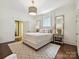 Beautiful bedroom featuring hardwood floors, neutral tones, and ample natural light at 1915 Winthrop Ave, Charlotte, NC 28203
