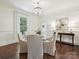 Elegant dining area with hardwood floors and modern chandelier at 1915 Winthrop Ave, Charlotte, NC 28203