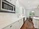 Kitchen with white cabinets and stainless steel microwave at 1915 Winthrop Ave, Charlotte, NC 28203