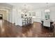 Open kitchen featuring a white island with bar seating and stainless steel appliances at 1915 Winthrop Ave, Charlotte, NC 28203