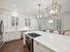 Bright white kitchen with subway tile backsplash and stainless steel appliances at 1915 Winthrop Ave, Charlotte, NC 28203