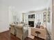 Bright living room with hardwood floors, white trim, and a fireplace focal point at 1915 Winthrop Ave, Charlotte, NC 28203