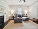 Comfortable living room with a fireplace, plush seating, and ample natural light at 1915 Winthrop Ave, Charlotte, NC 28203