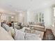 Living room with an open layout leading into kitchen and dining room at 1915 Winthrop Ave, Charlotte, NC 28203