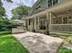 Outdoor kitchen and stone patio area with white columns supporting the covered porch at 1915 Winthrop Ave, Charlotte, NC 28203
