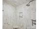 Modern shower with marble walls, a built-in shelf, and dual showerheads at 1915 Winthrop Ave, Charlotte, NC 28203