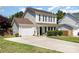 Charming two-story home featuring an attached garage and inviting front porch at 197 Devon Forest Dr, Mooresville, NC 28115