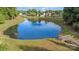 Picturesque pond with a small wooden bridge, ideal for relaxation and enjoying nature at 197 Devon Forest Dr, Mooresville, NC 28115