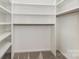 Spacious walk-in closet with custom shelving at 197 Devon Forest Dr, Mooresville, NC 28115