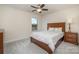 Inviting bedroom with soft carpet, large bed, and a traditional nightstand at 2014 Drawbridge Dr, Fort Mill, SC 29707