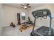 Functional exercise room with treadmill, free weights, punching bag and ceiling fan at 2014 Drawbridge Dr, Fort Mill, SC 29707